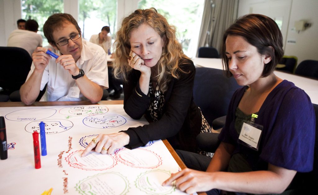 2010 PopTech Science and Public Leadership Fellows talking together
